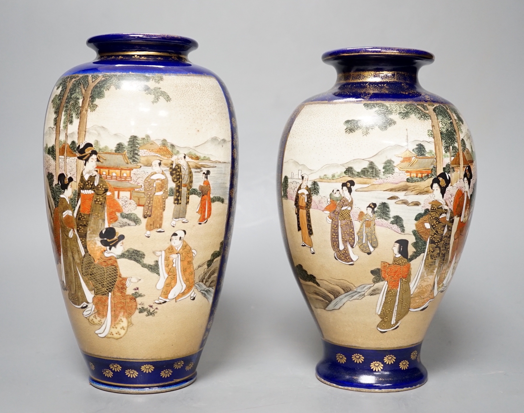 A pair of Japanese Satsuma pottery vases, one signed Kinkozan - 25cm high